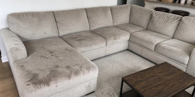 Sectional sofa before cleaning — grease and pet hair in Orlando home